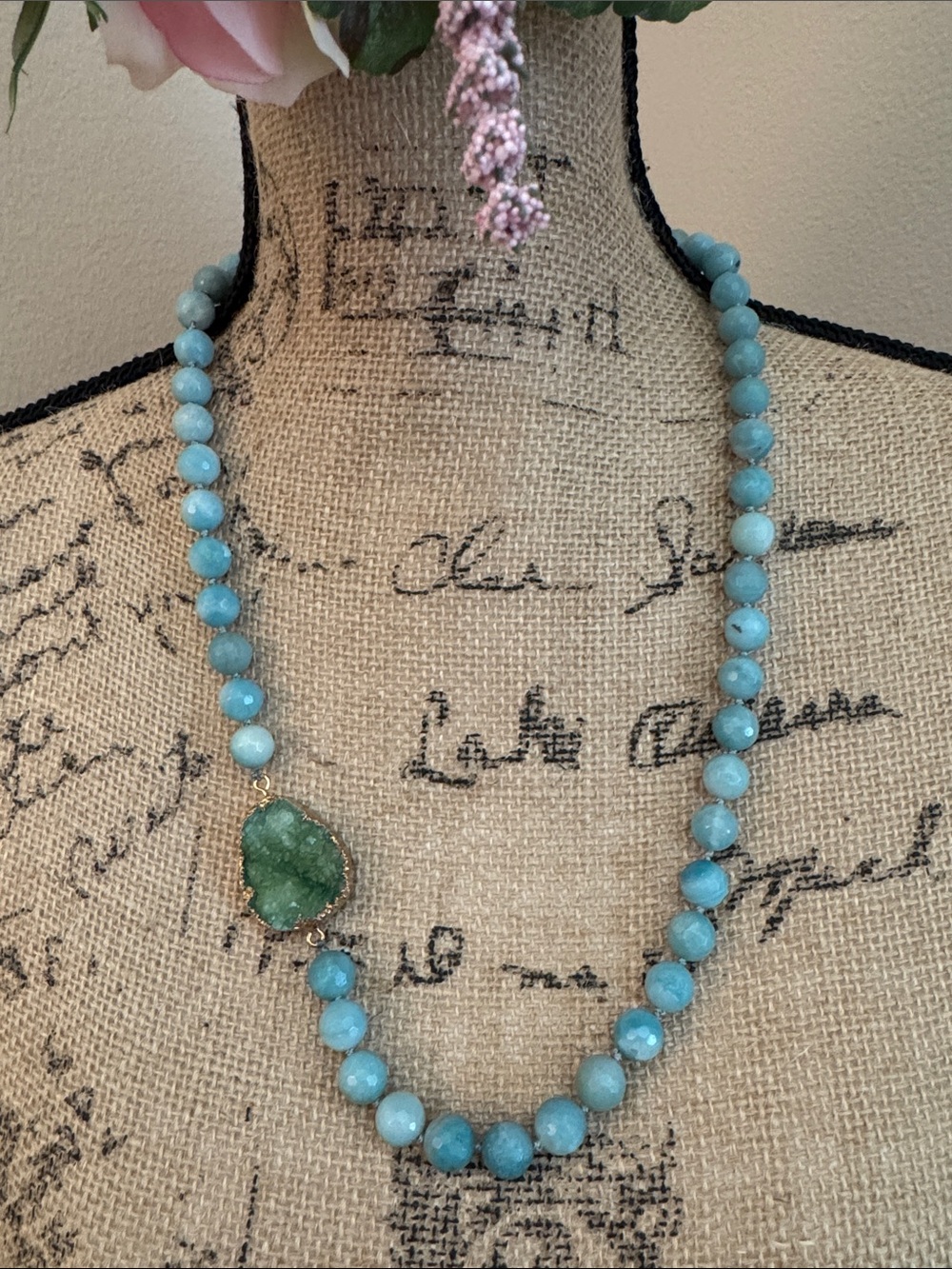Blue stone beaded necklace hand knotted with geode center charm.